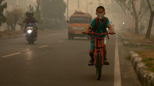 Boy, bike and smoke