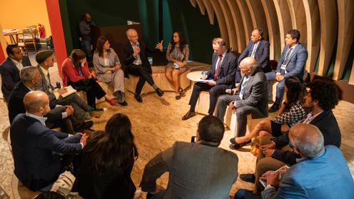 A panel discusses climate-smart crops with participants