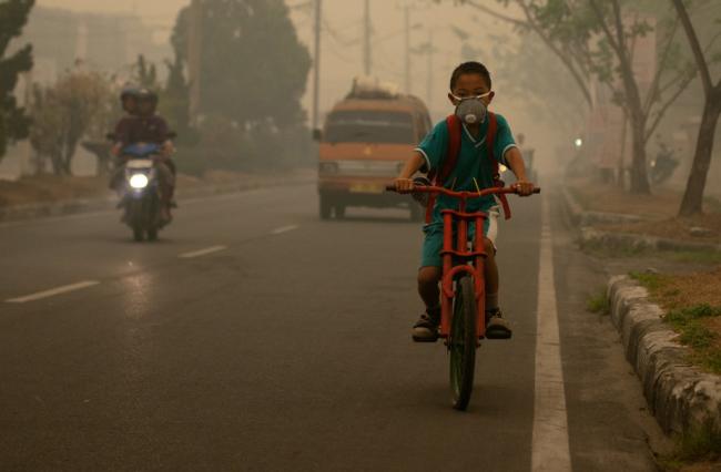 Boy, bike and smoke