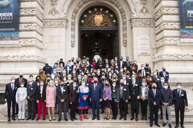 Participants pose for a group photo during the first day of the Scientific Symposium