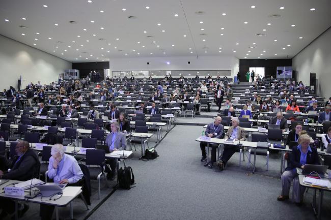 Delegates gathering for the afternoon plenary 