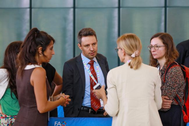 Delegates from Europe consulting during a break