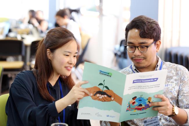 Youth participants reading the Summary of General Comments