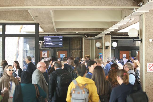 Delegates waiting outside the plenary room during regional meetings