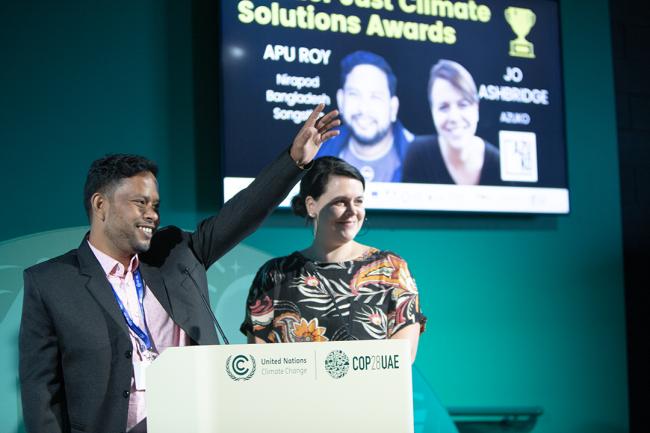 Ashbridge, Azuko and Apu Roy, Nirapod Bangladesh Songstha received the award on behalf of the Azuko Project - WECF-Side Event -COP28 5dec2023 - Photo.jpg