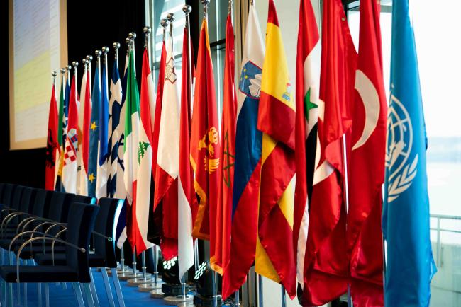 Member state flags behind the podium