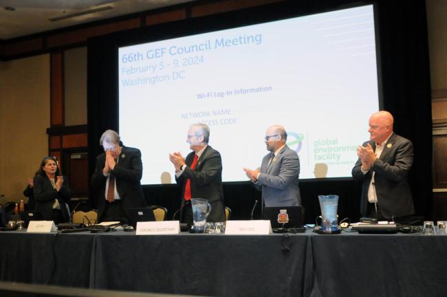 The dais applaud Juha Ilari Uitto on his departure as a Director of the GEF IEO