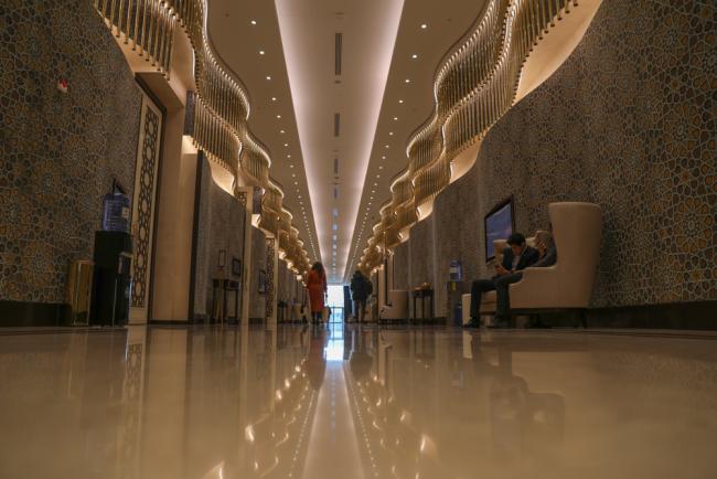 Delegates walk through the corridors