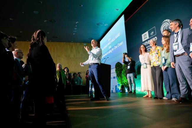 Haakoon Vatle, Leader of the One Ocean Expedition, gathers participants to sing a sea shanty UNOceanDecade-12April2024-photo