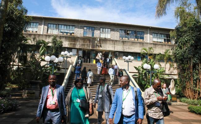 Delegates arriving for the morning plenary