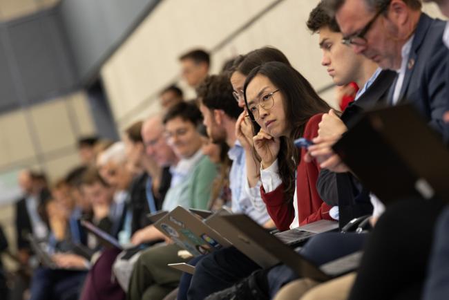 Delegates listen to deliberations throughout the day