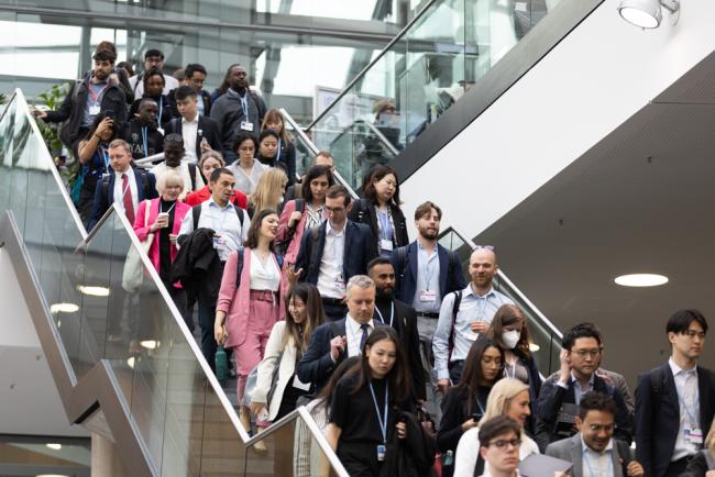 Delegates move between sessions as various informal consultations happen throughout the day