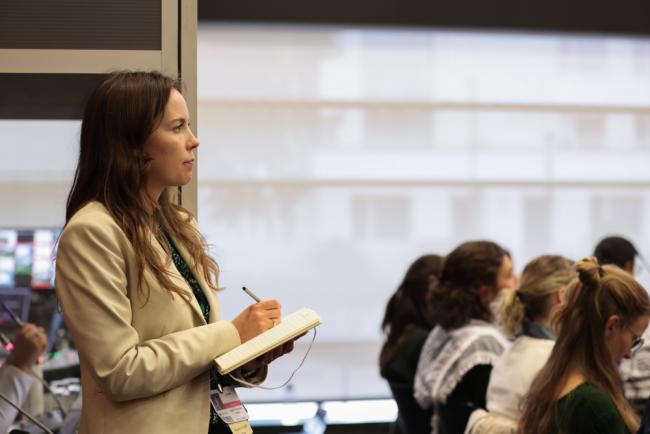 A delegate takes notes during the consultations on the new finance goal