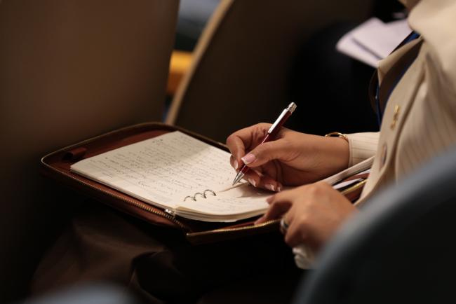 Delegate takes notes