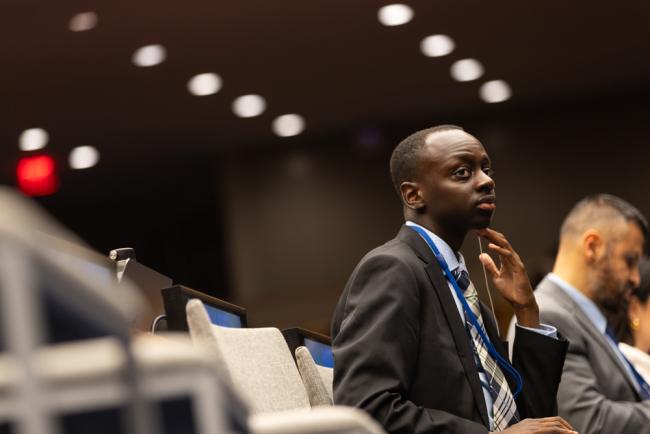 A delegate listens to the VNR presentations